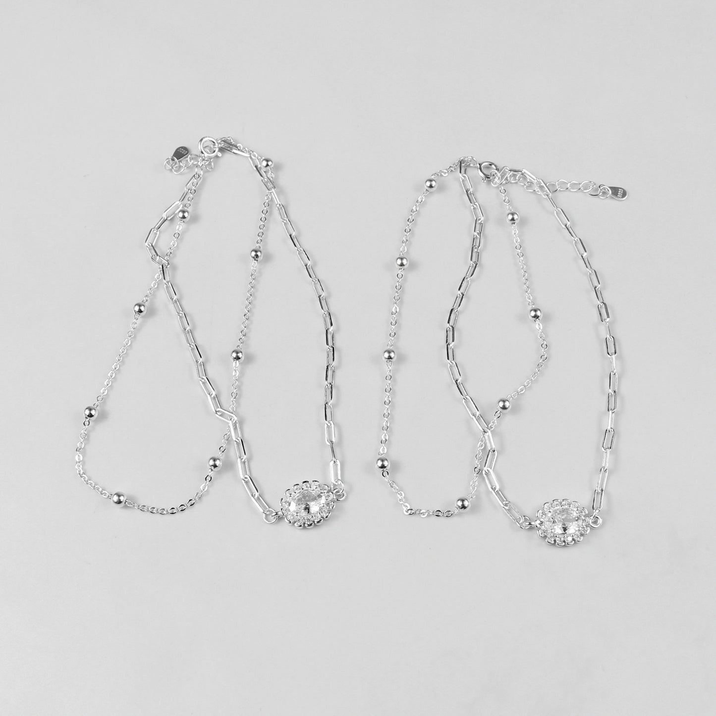 A sophisticated set of 'Serein Anklets,' made with 925 sterling silver, blending timeless elegance with a serene and flowing design.