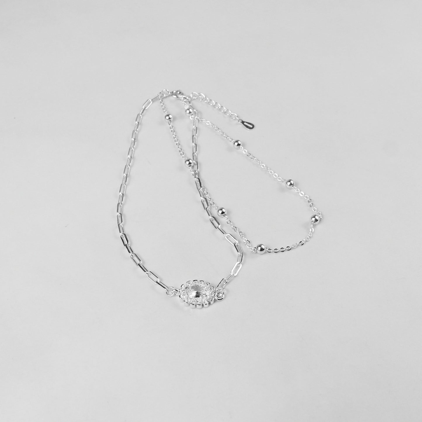 A sophisticated set of 'Serein Anklets,' made with 925 sterling silver, blending timeless elegance with a serene and flowing design.