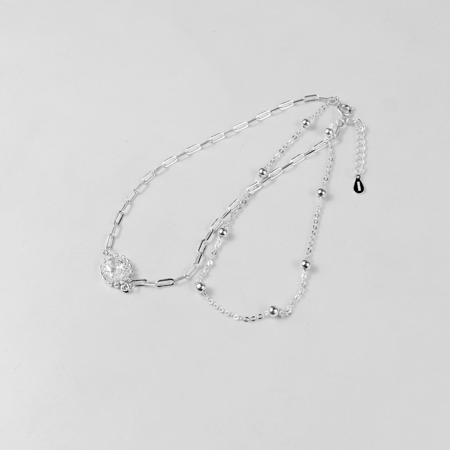 A sophisticated set of 'Serein Anklets,' made with 925 sterling silver, blending timeless elegance with a serene and flowing design.