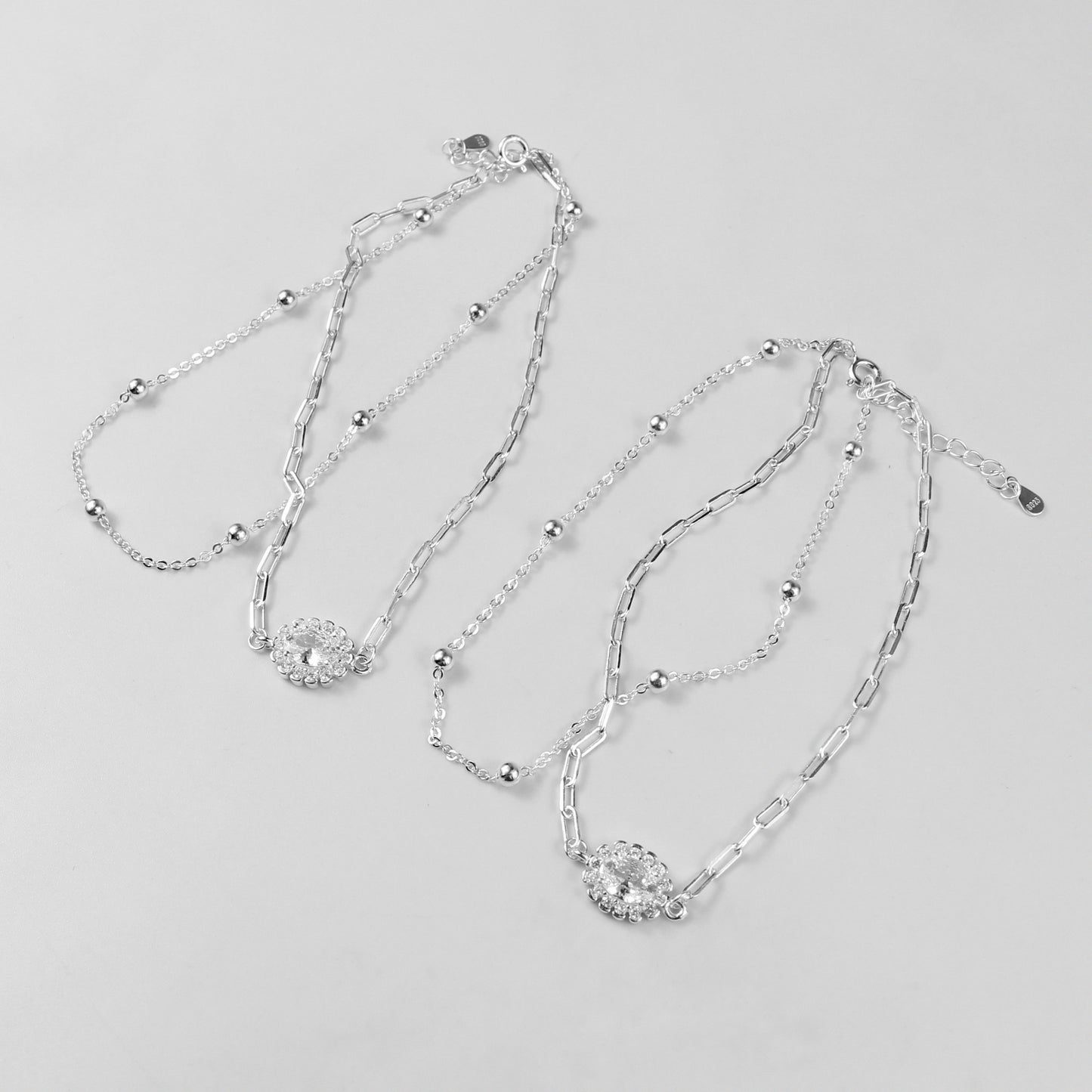 A sophisticated set of 'Serein Anklets,' made with 925 sterling silver, blending timeless elegance with a serene and flowing design.