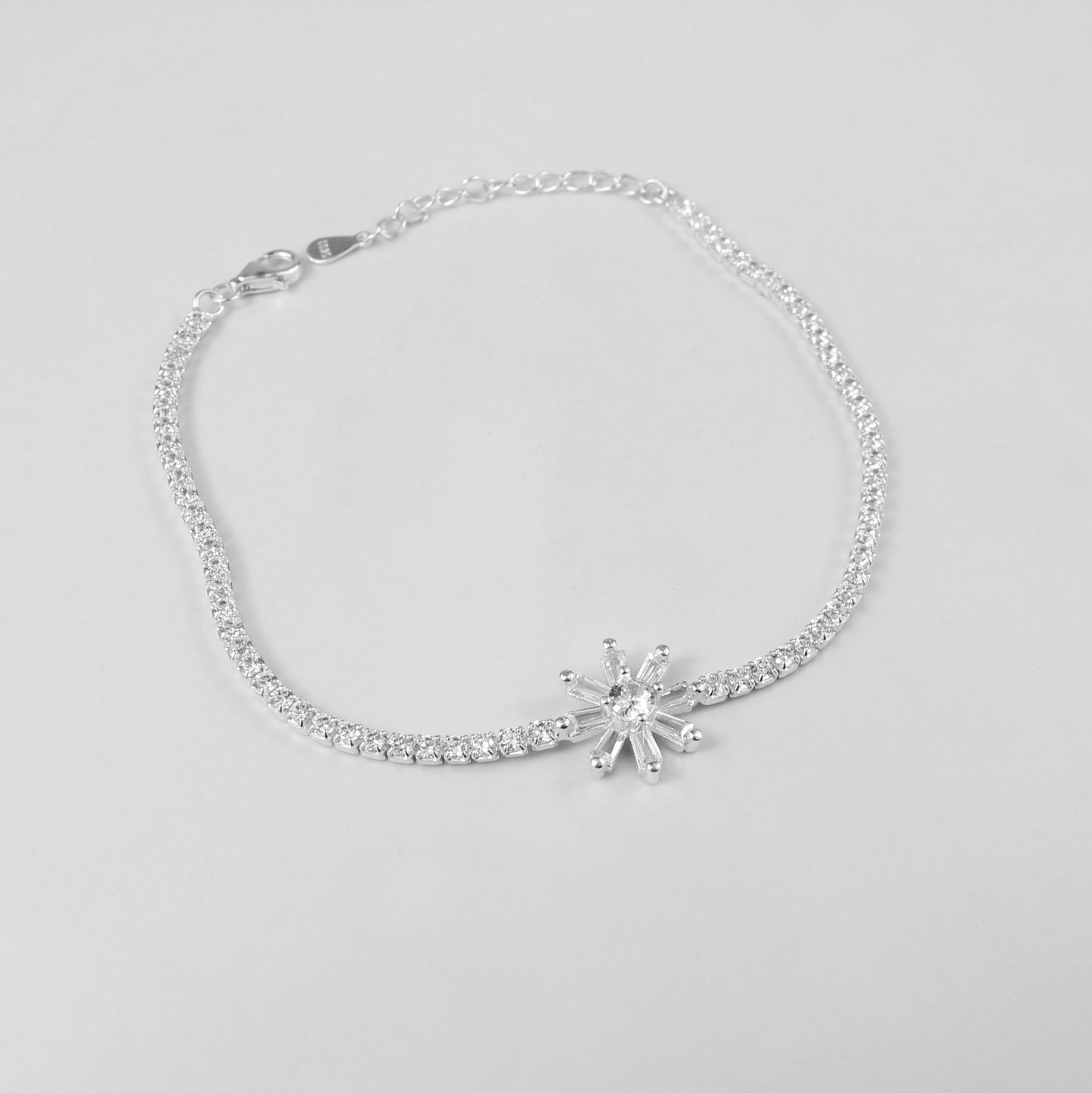 The 'Celestia Stone' bracelet, crafted from 925 sterling silver, featuring a radiant design with a central stone that evokes the ethereal beauty of the cosmos.