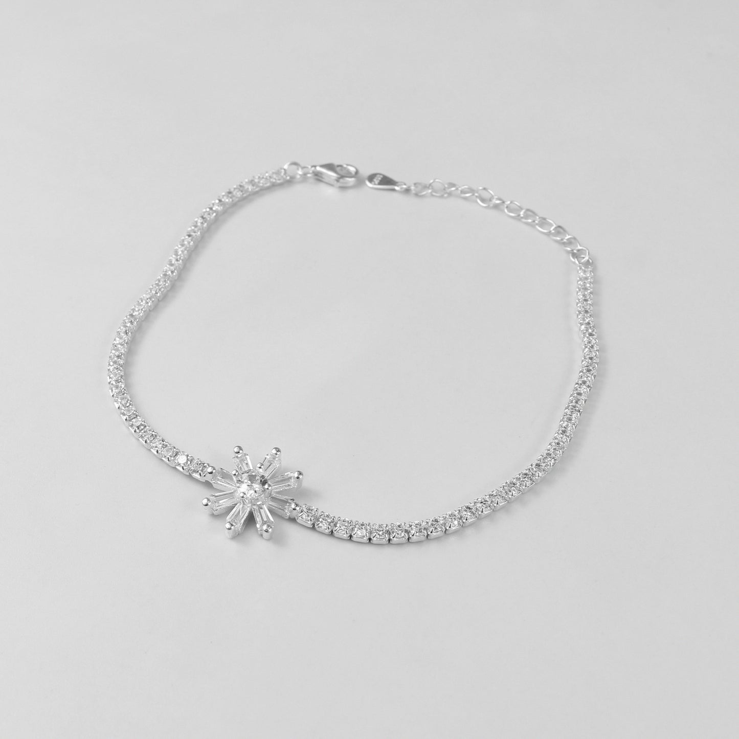 The 'Celestia Stone' bracelet, crafted from 925 sterling silver, featuring a radiant design with a central stone that evokes the ethereal beauty of the cosmos.