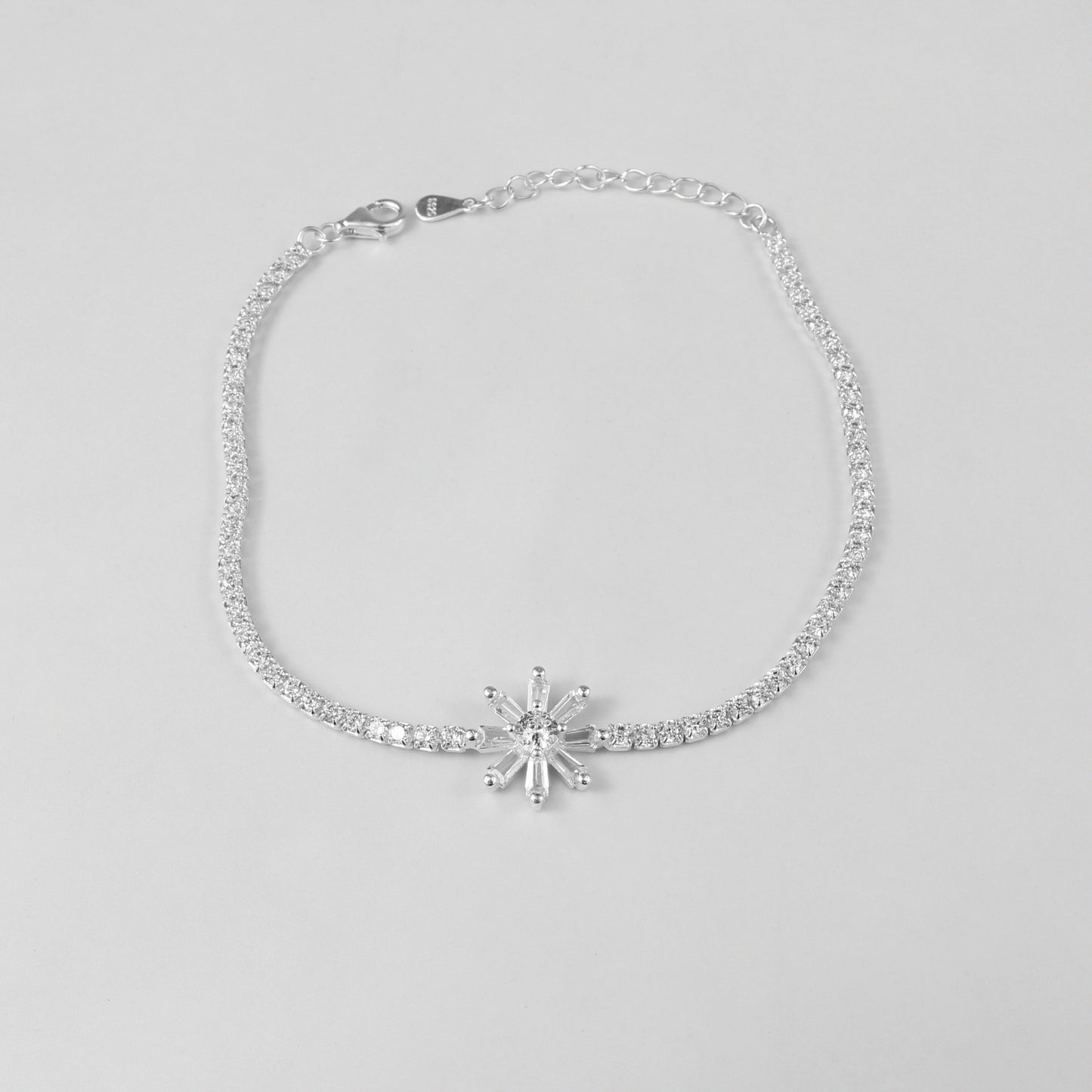 The 'Celestia Stone' bracelet, crafted from 925 sterling silver, featuring a radiant design with a central stone that evokes the ethereal beauty of the cosmos.