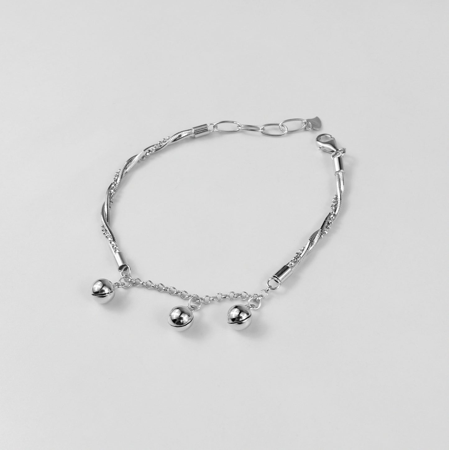 A refined 'Chained Harmony' bracelet in 925 sterling silver, showcasing a graceful chain motif that embodies timeless harmony and connection.