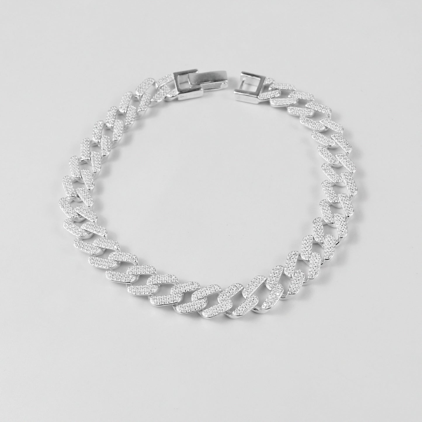 The 'Crystal Cuban' bracelet, crafted from 925 sterling silver, featuring a classic Cuban link design adorned with sparkling crystal accents.