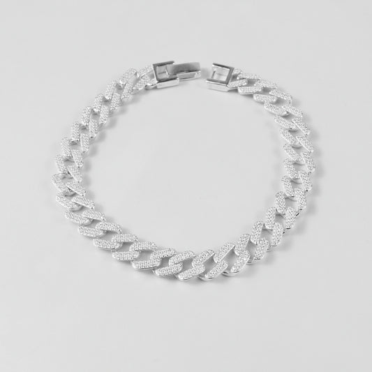 The 'Crystal Cuban' bracelet, crafted from 925 sterling silver, featuring a classic Cuban link design adorned with sparkling crystal accents.