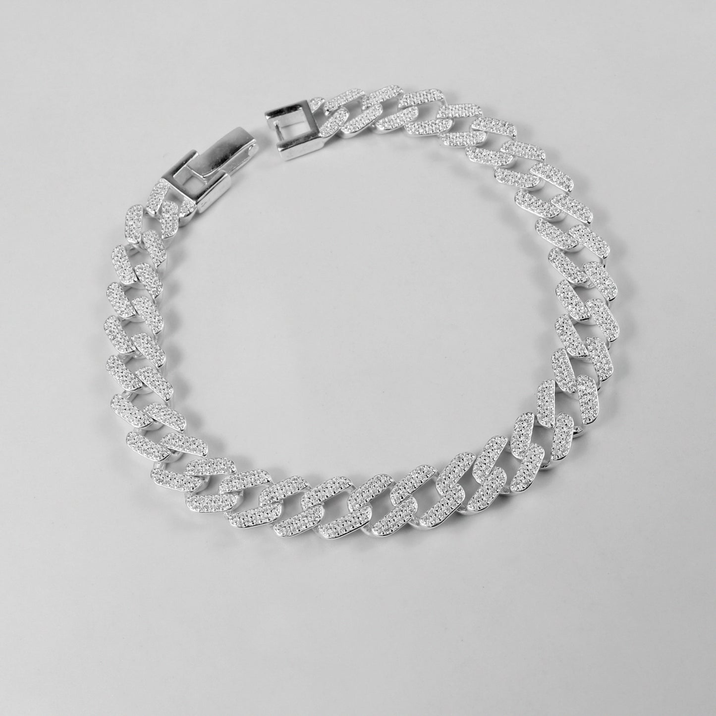 The 'Crystal Cuban' bracelet, crafted from 925 sterling silver, featuring a classic Cuban link design adorned with sparkling crystal accents.