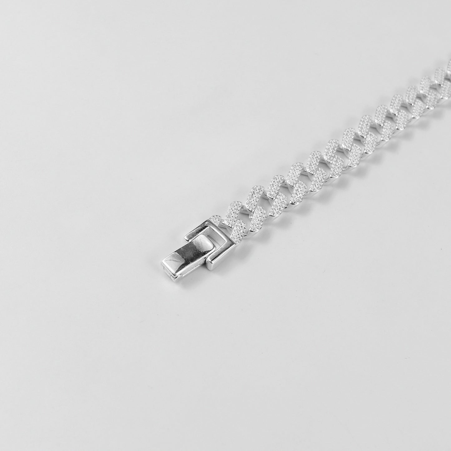 The 'Crystal Cuban' bracelet, crafted from 925 sterling silver, featuring a classic Cuban link design adorned with sparkling crystal accents.