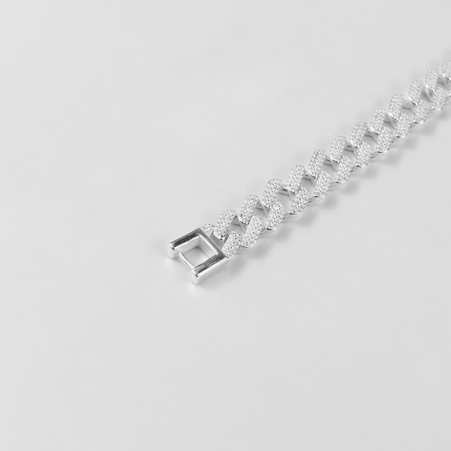 The 'Crystal Cuban' bracelet, crafted from 925 sterling silver, featuring a classic Cuban link design adorned with sparkling crystal accents.