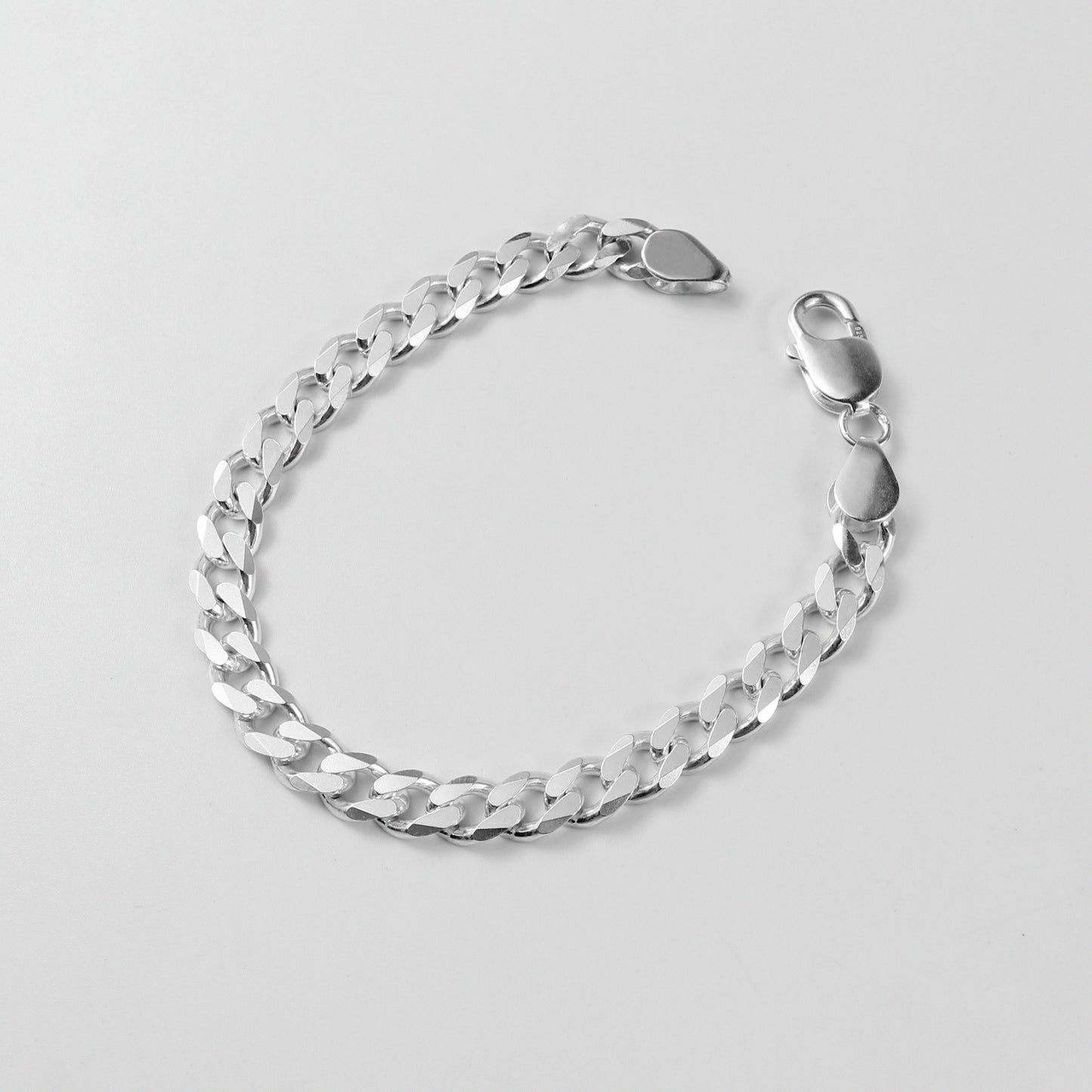 Cuban Link Bracelet - An elegant 925 sterling silver bracelet by GetTheJuice, with intricately crafted Cuban links that bring a timeless charm to any ensemble.