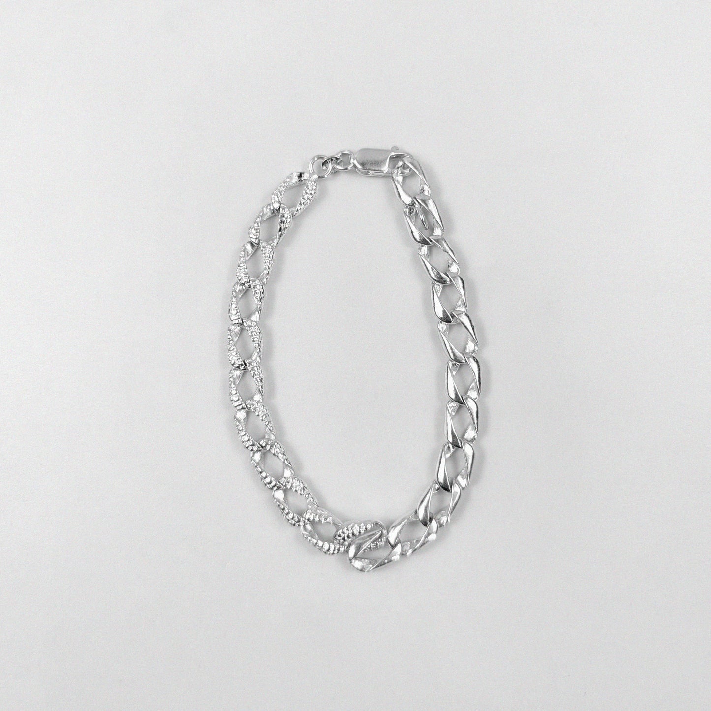 Diff Cuban Link Bracelet - A distinctive 925 sterling silver bracelet by GetTheJuice, featuring a unique twist on the classic Cuban link design, adding a modern edge to any wrist.