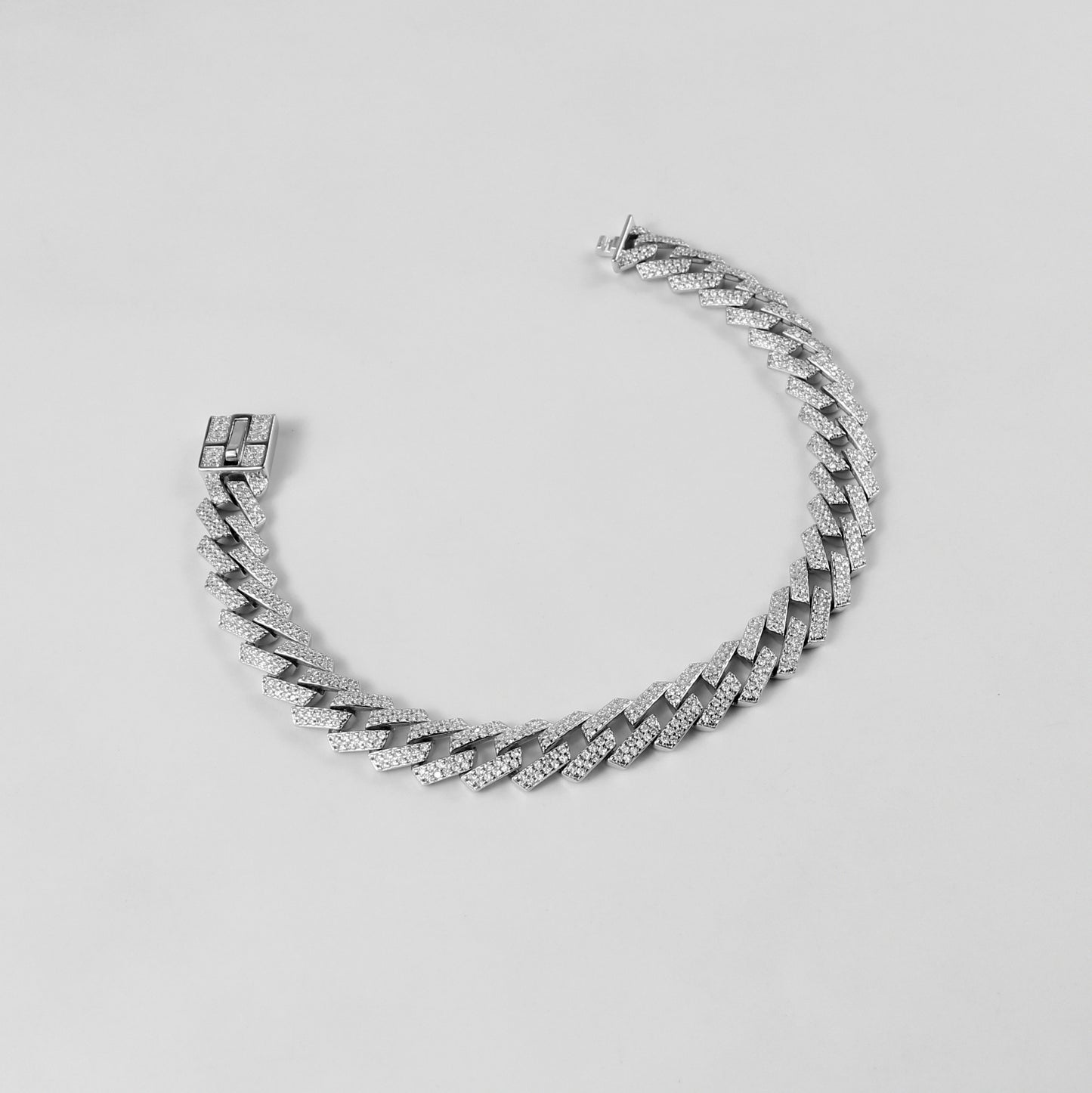 The 'Glittering Garland' bracelet, a luxurious piece of 925 sterling silver jewelry, designed with intricate detailing that mimics the beauty of a radiant garland.