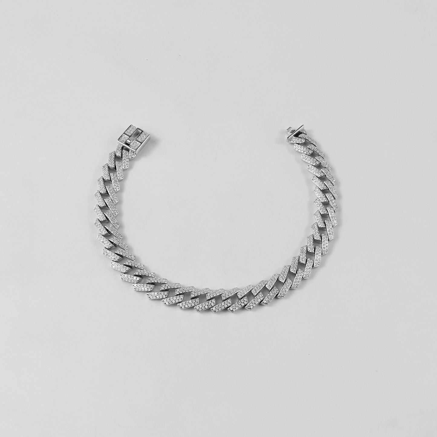 The 'Glittering Garland' bracelet, a luxurious piece of 925 sterling silver jewelry, designed with intricate detailing that mimics the beauty of a radiant garland.