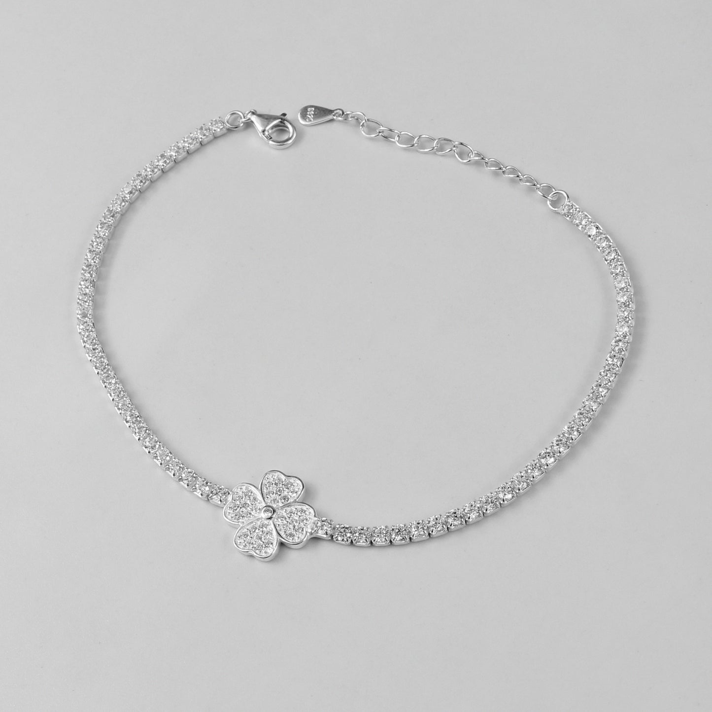 A sophisticated 'LunaBloom' bracelet, made with 925 sterling silver, evoking the harmony between celestial radiance and blossoming nature.