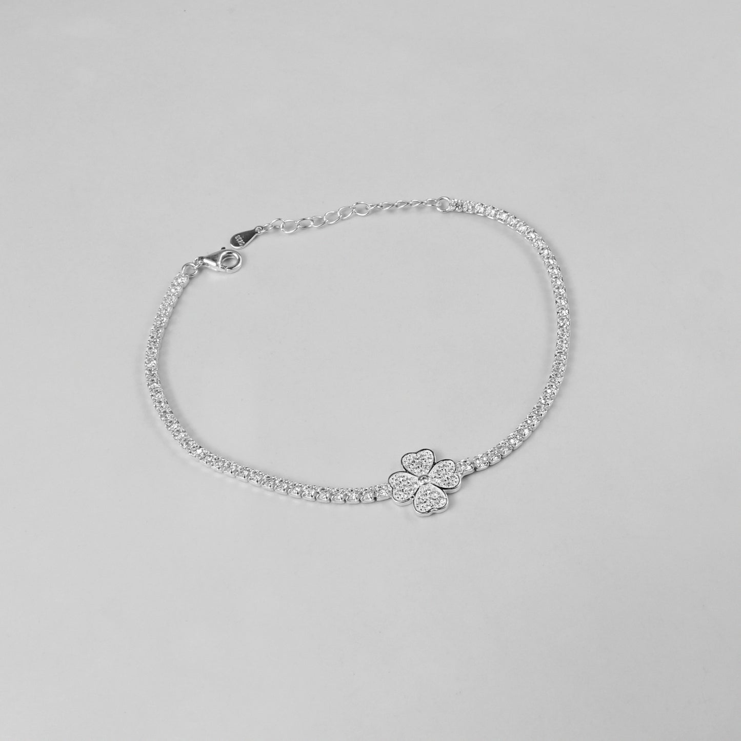 A sophisticated 'LunaBloom' bracelet, made with 925 sterling silver, evoking the harmony between celestial radiance and blossoming nature.