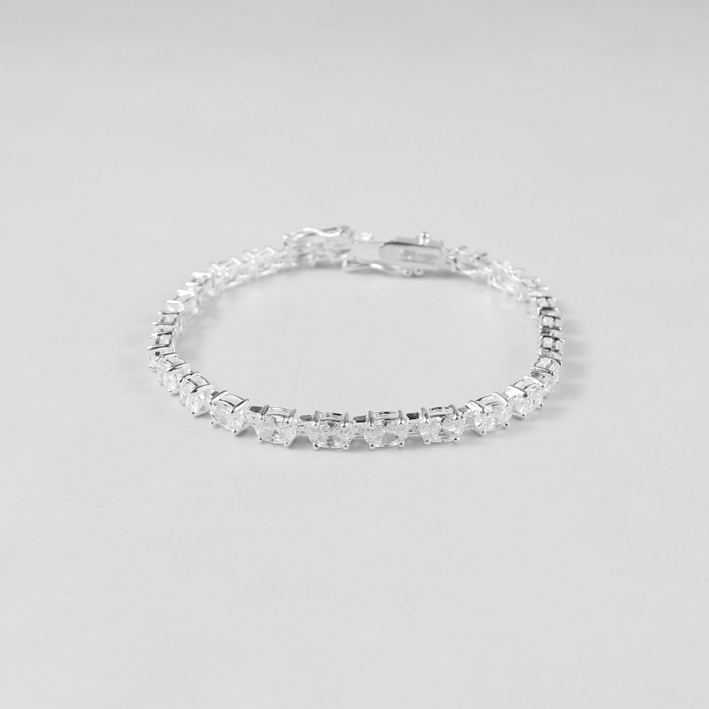 The 'Prismatic Beam' bracelet, crafted from 925 sterling silver, featuring a radiant design that captures the brilliance and spectrum of prismatic light.