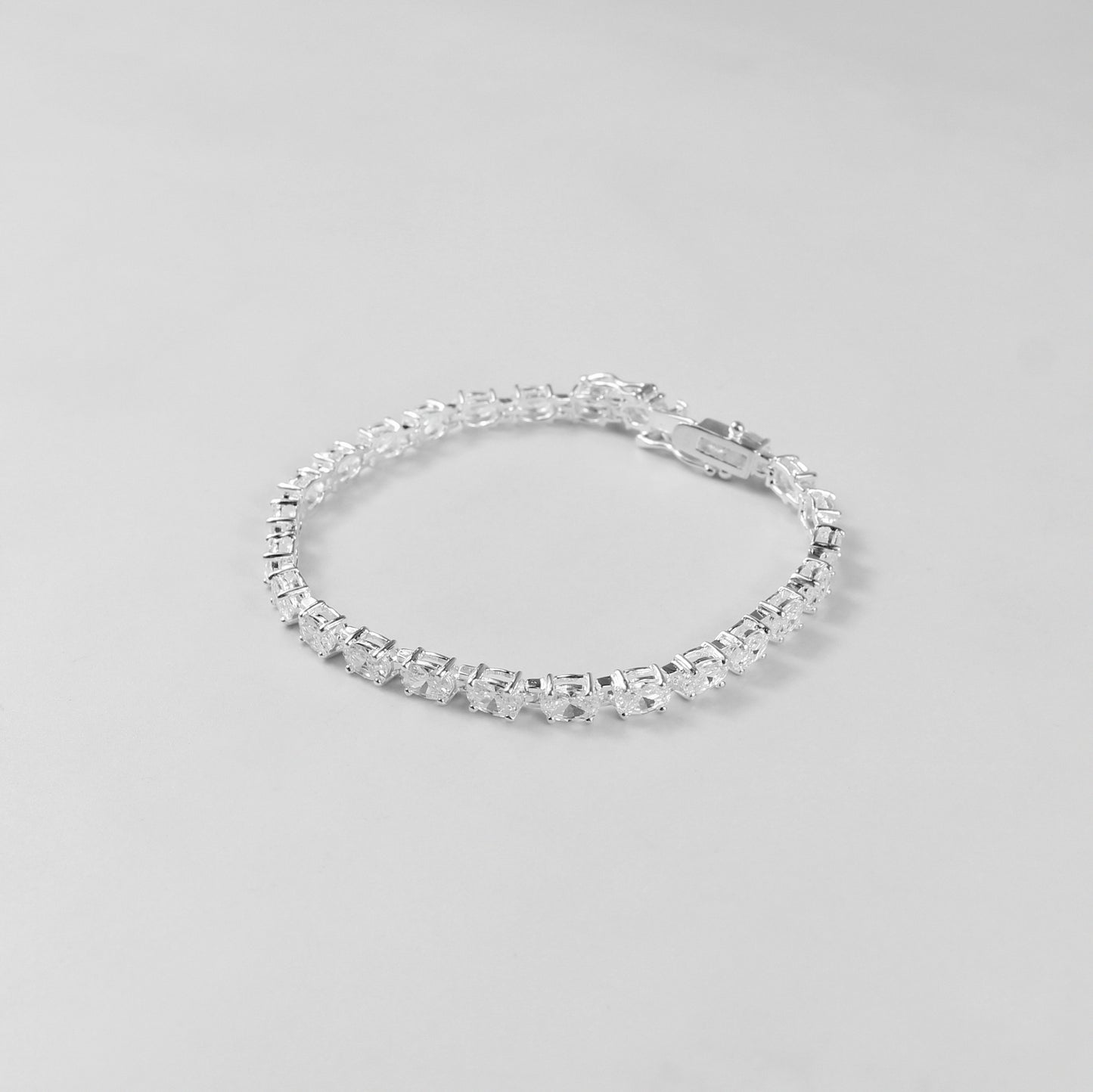 The 'Prismatic Beam' bracelet, crafted from 925 sterling silver, featuring a radiant design that captures the brilliance and spectrum of prismatic light.