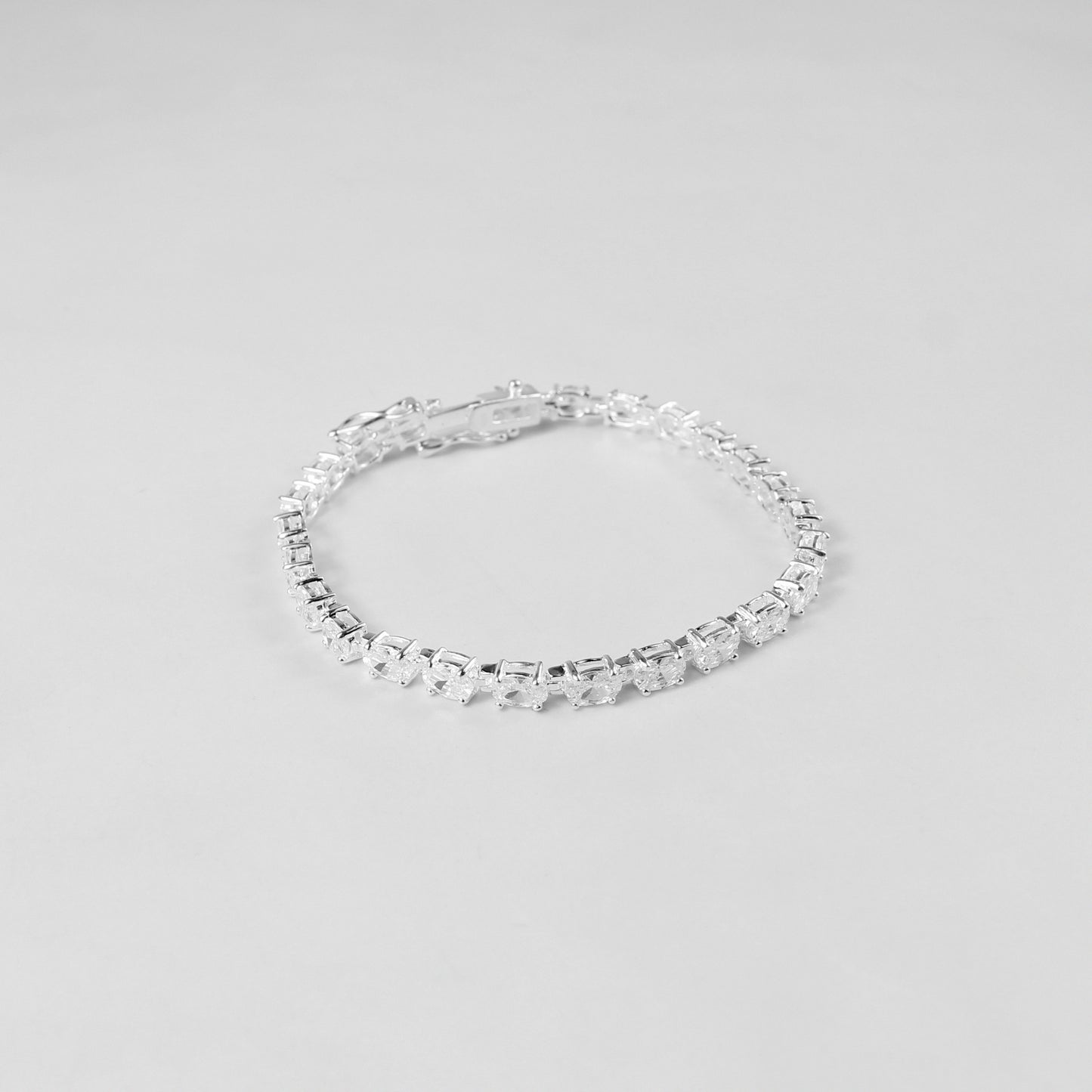 The 'Prismatic Beam' bracelet, crafted from 925 sterling silver, featuring a radiant design that captures the brilliance and spectrum of prismatic light.