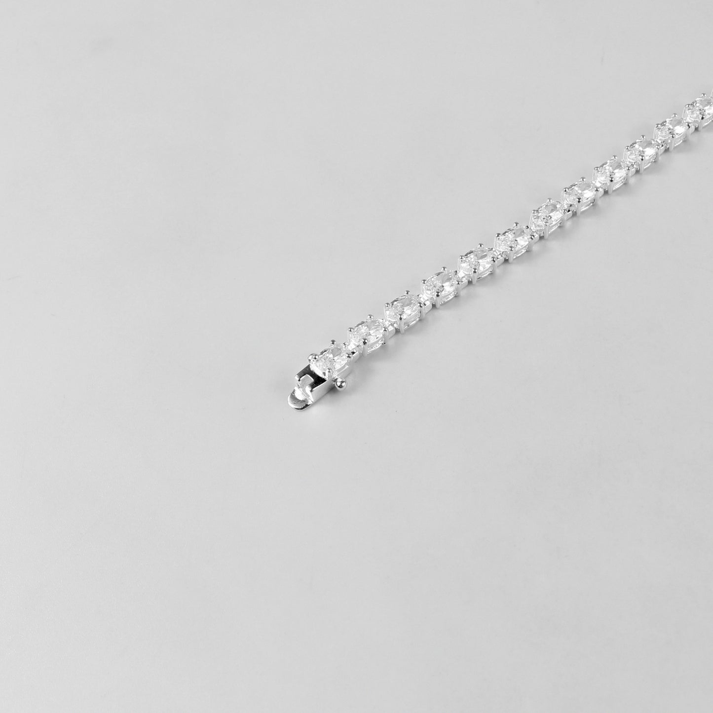 The 'Prismatic Beam' bracelet, crafted from 925 sterling silver, featuring a radiant design that captures the brilliance and spectrum of prismatic light.