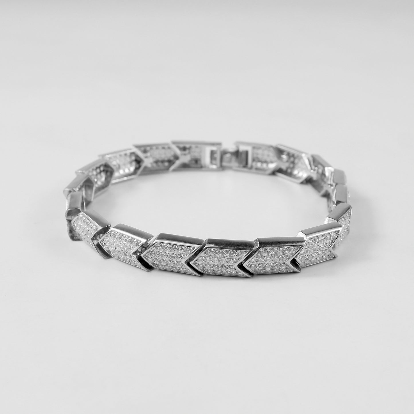 The 'Prism Link' bracelet, crafted from 925 sterling silver, featuring a unique interlocking design inspired by the multifaceted beauty of a prism.