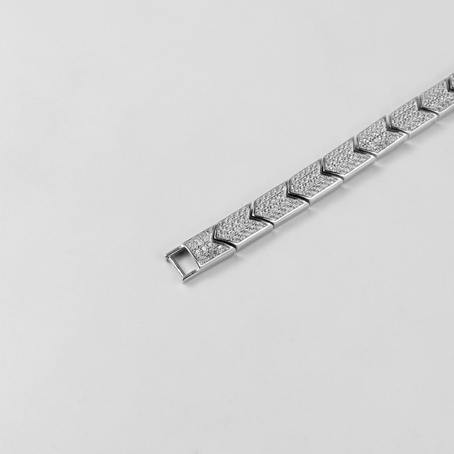 The 'Prism Link' bracelet, crafted from 925 sterling silver, featuring a unique interlocking design inspired by the multifaceted beauty of a prism.