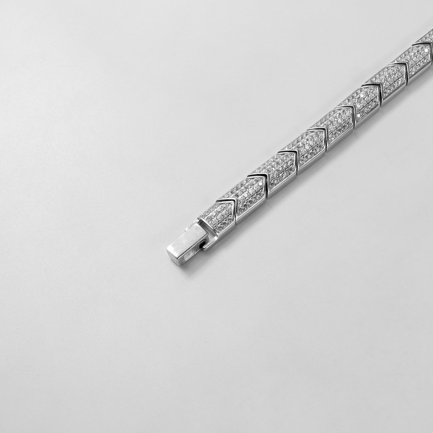 The 'Prism Link' bracelet, crafted from 925 sterling silver, featuring a unique interlocking design inspired by the multifaceted beauty of a prism.