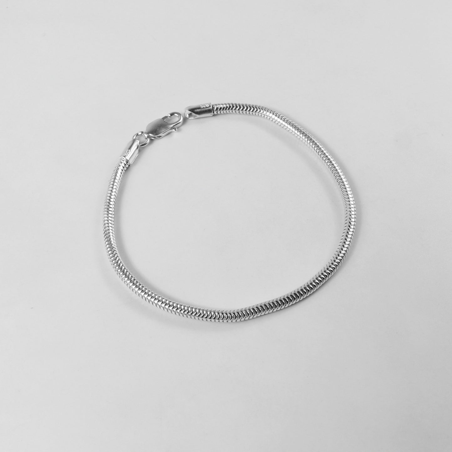 Round Snake Bracelet - A sleek 925 sterling silver bracelet by GetTheJuice, featuring a smooth and elegant round snake chain design that adds a modern touch to any wrist.
