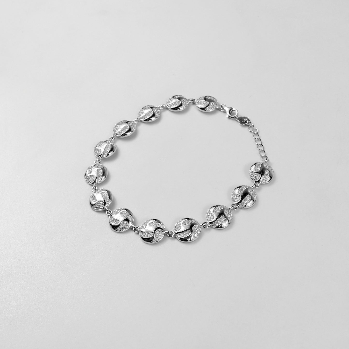 The 'Serene Ripple' bracelet, crafted from 925 sterling silver, featuring a flowing design inspired by the gentle and calming movement of water ripples.