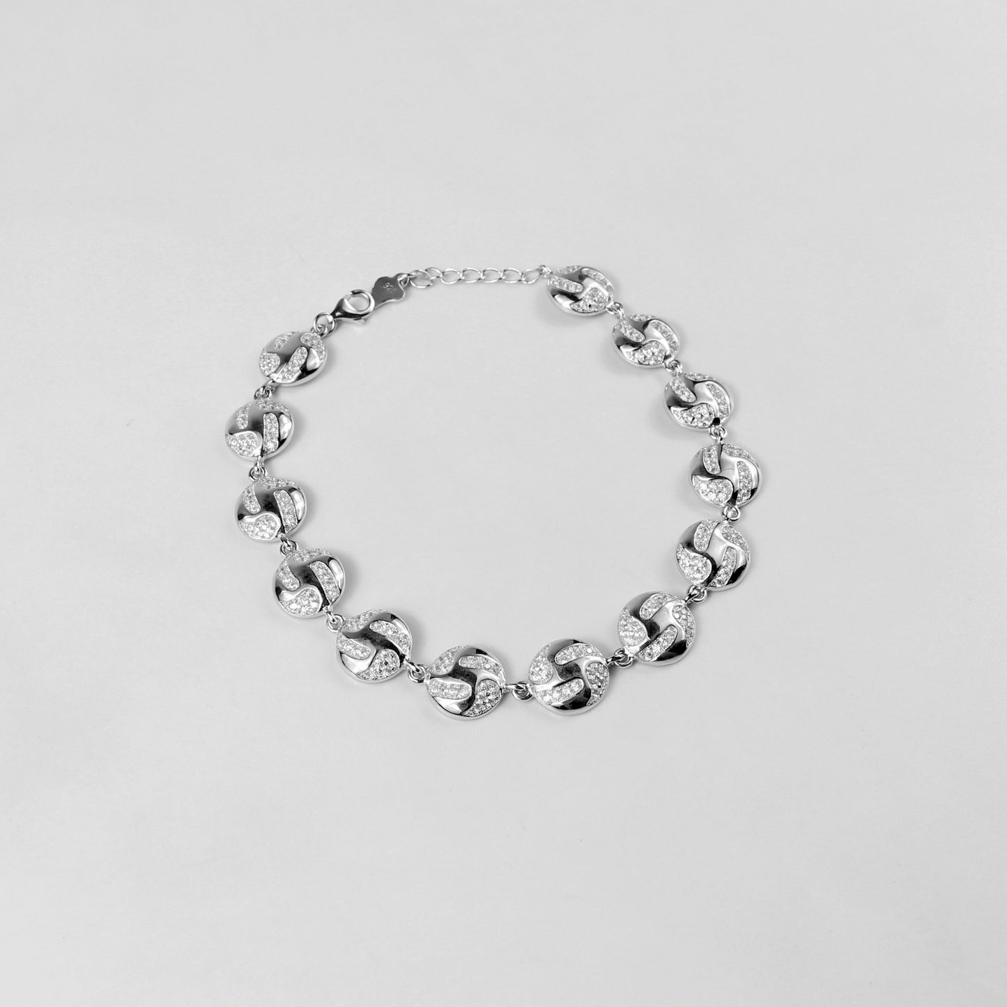 The 'Serene Ripple' bracelet, crafted from 925 sterling silver, featuring a flowing design inspired by the gentle and calming movement of water ripples.