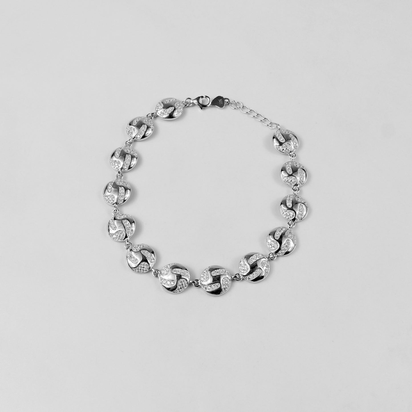 The 'Serene Ripple' bracelet, crafted from 925 sterling silver, featuring a flowing design inspired by the gentle and calming movement of water ripples.