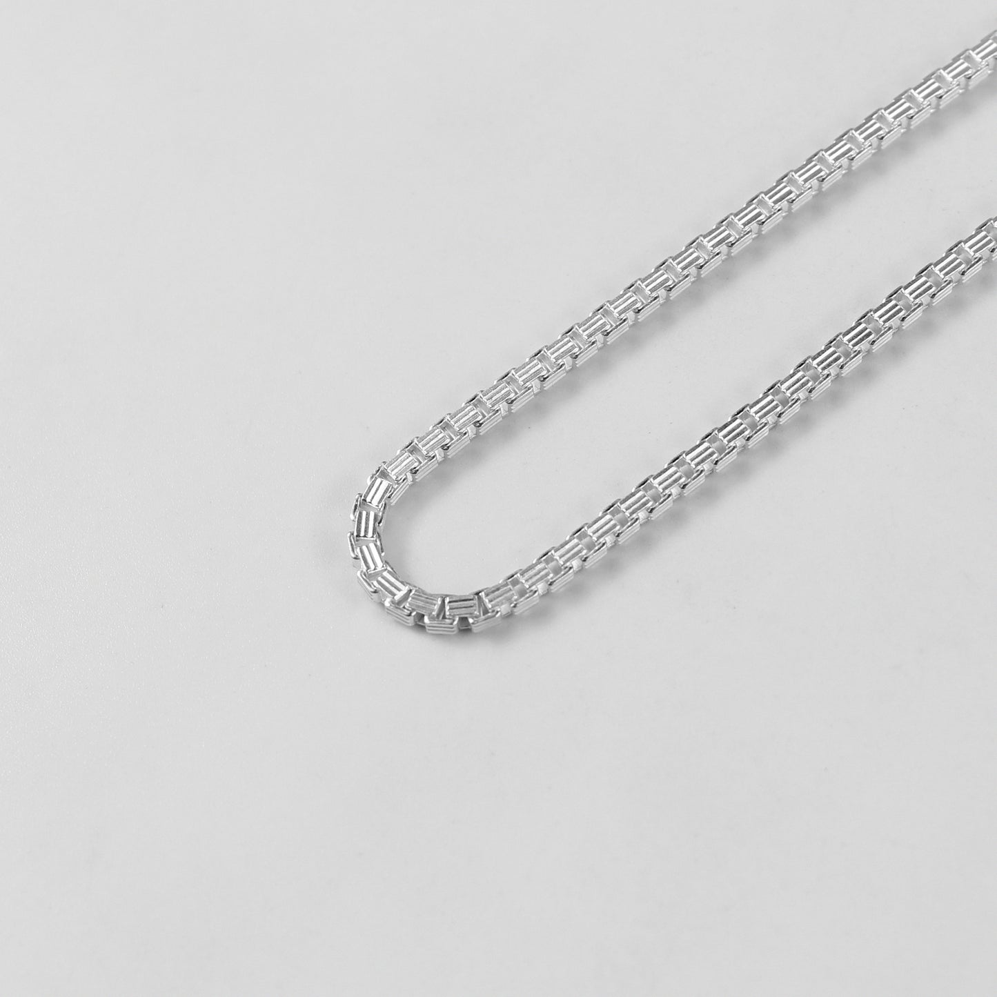 The 'Silken Glide' bracelet, crafted from 925 sterling silver, featuring a smooth and fluid design that embodies effortless grace.