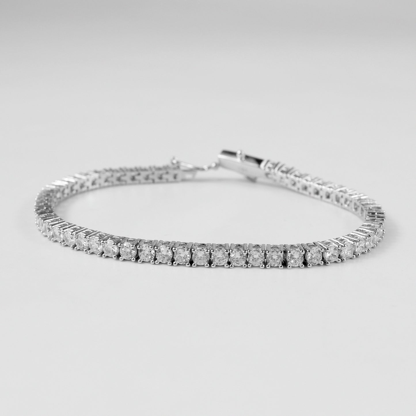 Tennis Bracelet - A classic 925 sterling silver bracelet by GetTheJuice, featuring a continuous row of sparkling stones that add timeless elegance and sophistication to any wrist.