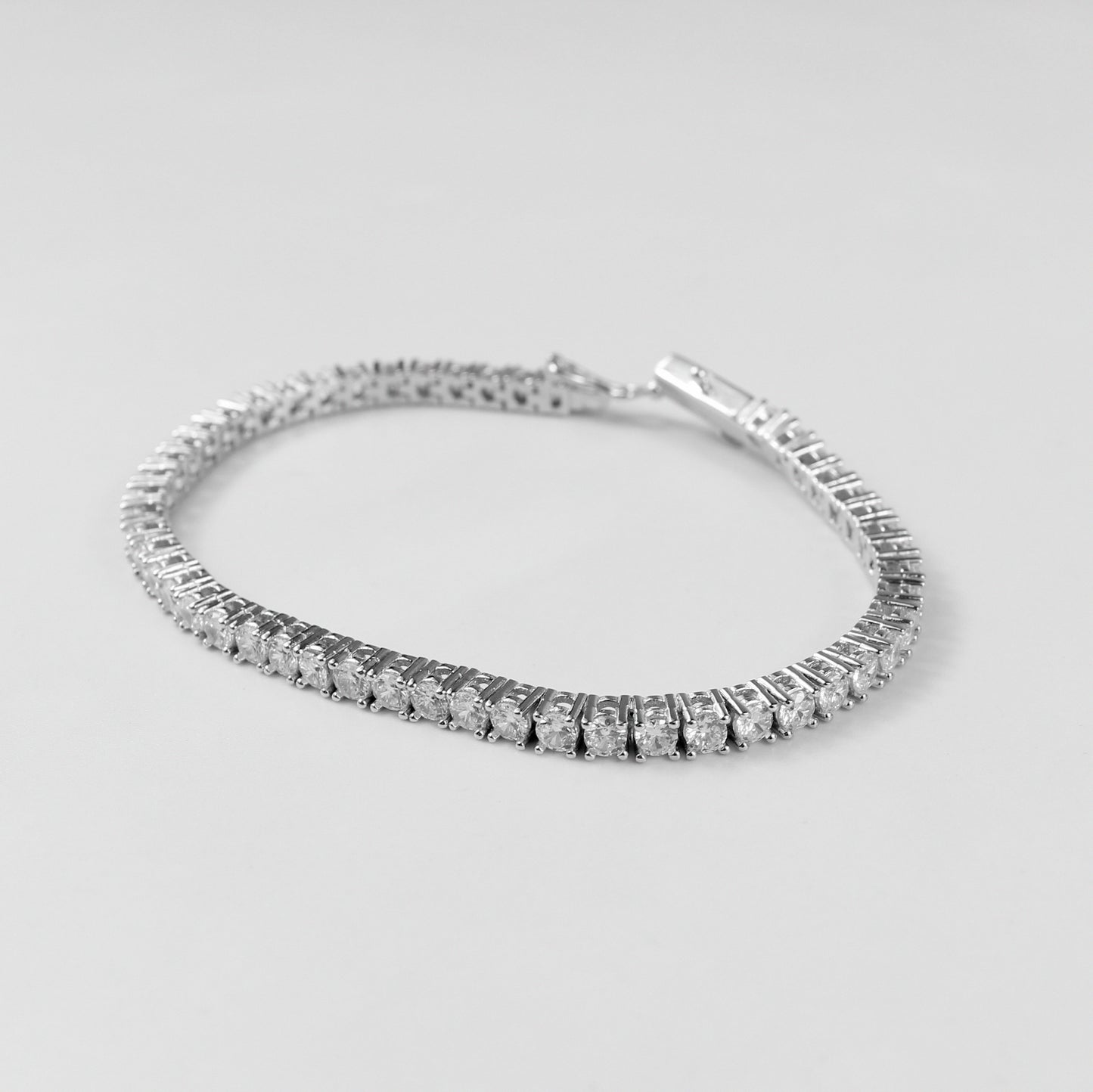 Tennis Bracelet - A classic 925 sterling silver bracelet by GetTheJuice, featuring a continuous row of sparkling stones that add timeless elegance and sophistication to any wrist.
