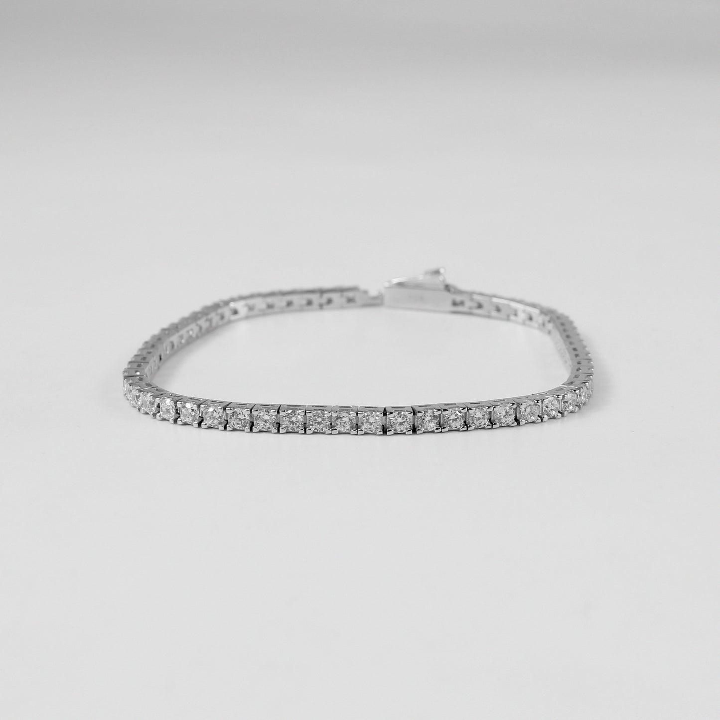 Tennis Bracelet - A classic 925 sterling silver bracelet by GetTheJuice, featuring a continuous row of sparkling stones that add timeless elegance and sophistication to any wrist.