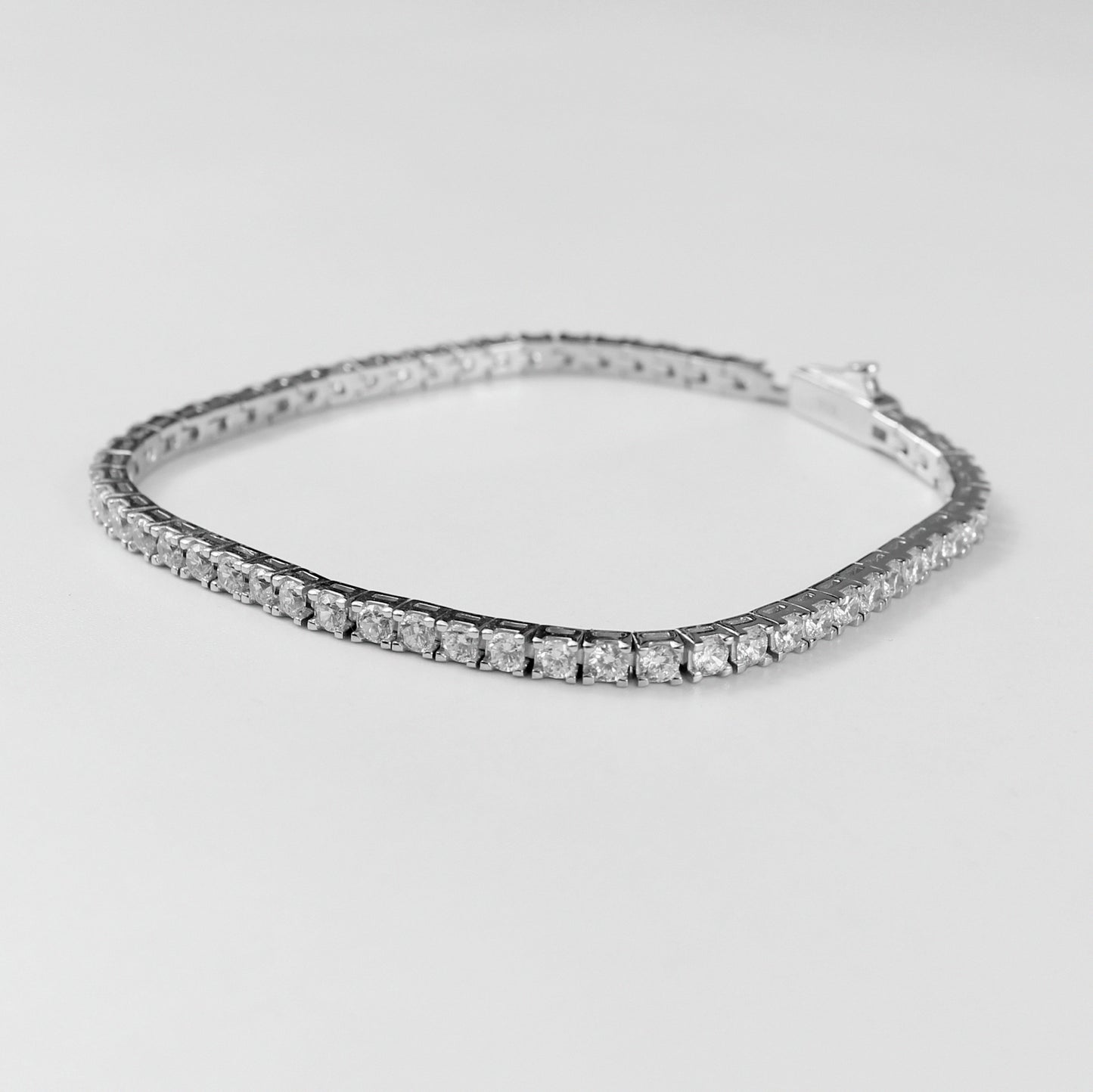 Tennis Bracelet - A classic 925 sterling silver bracelet by GetTheJuice, featuring a continuous row of sparkling stones that add timeless elegance and sophistication to any wrist.