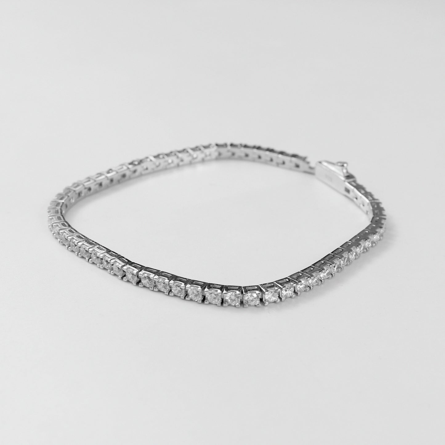 Tennis Bracelet - A classic 925 sterling silver bracelet by GetTheJuice, featuring a continuous row of sparkling stones that add timeless elegance and sophistication to any wrist.