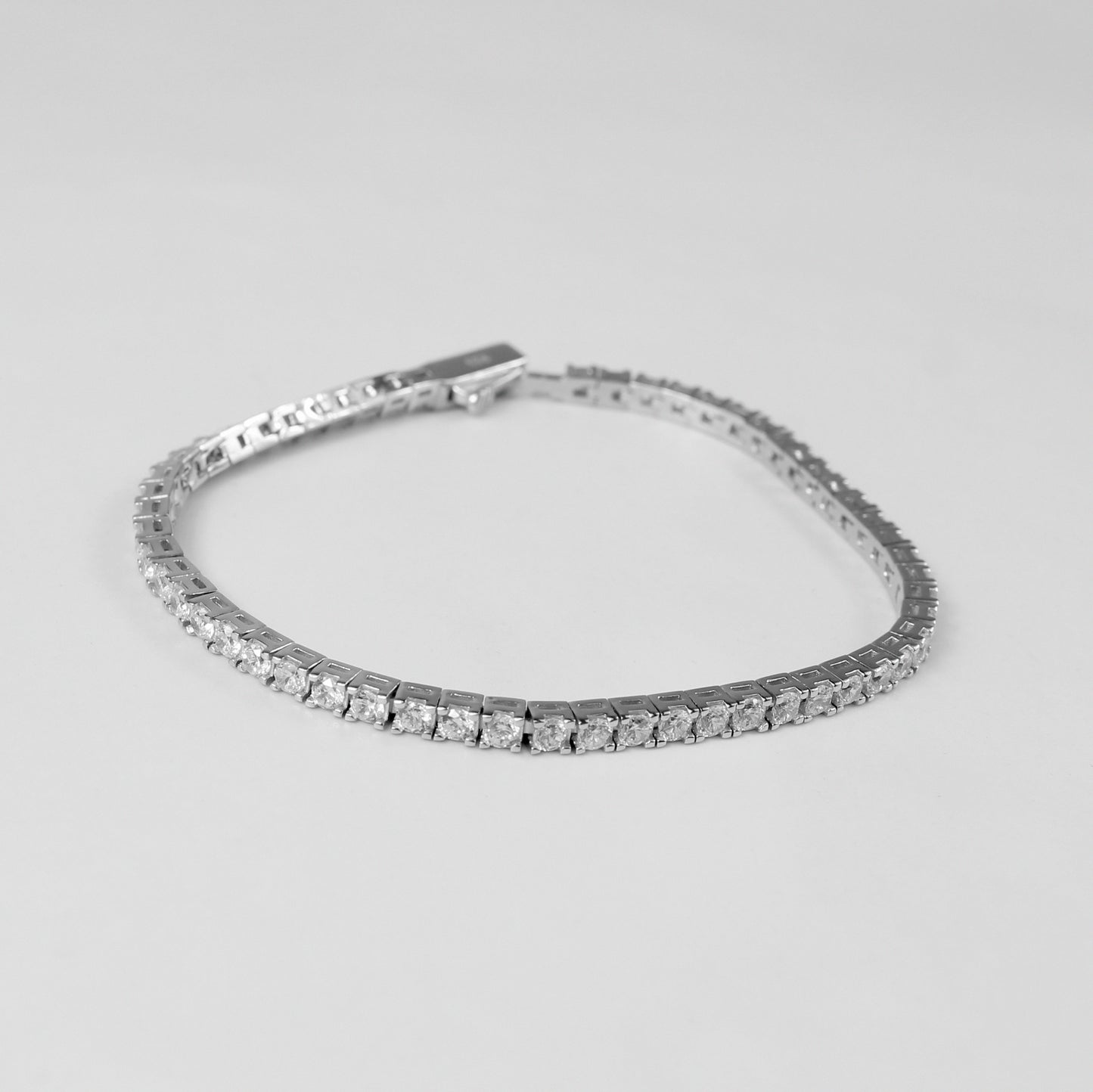 Tennis Bracelet - A classic 925 sterling silver bracelet by GetTheJuice, featuring a continuous row of sparkling stones that add timeless elegance and sophistication to any wrist.