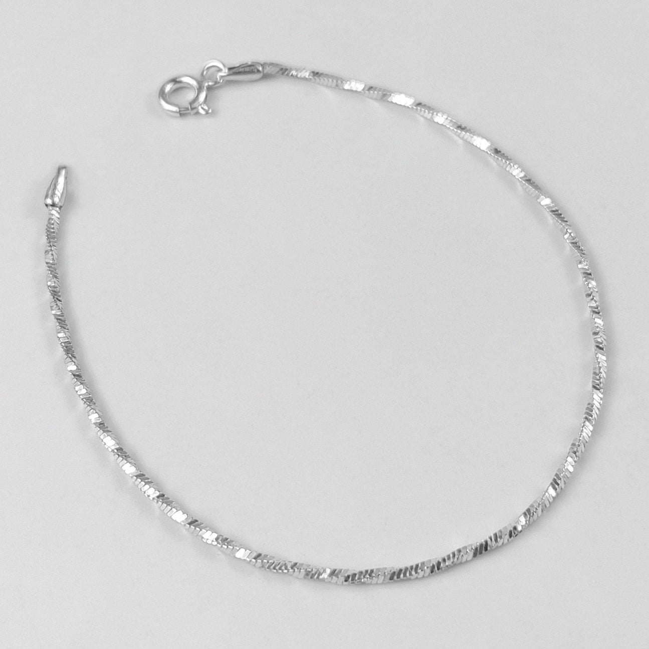 Twilight Twist Bracelet - An exquisite 925 sterling silver bracelet by GetTheJuice, showcasing a unique twilight-inspired twist pattern for a refined and graceful look.