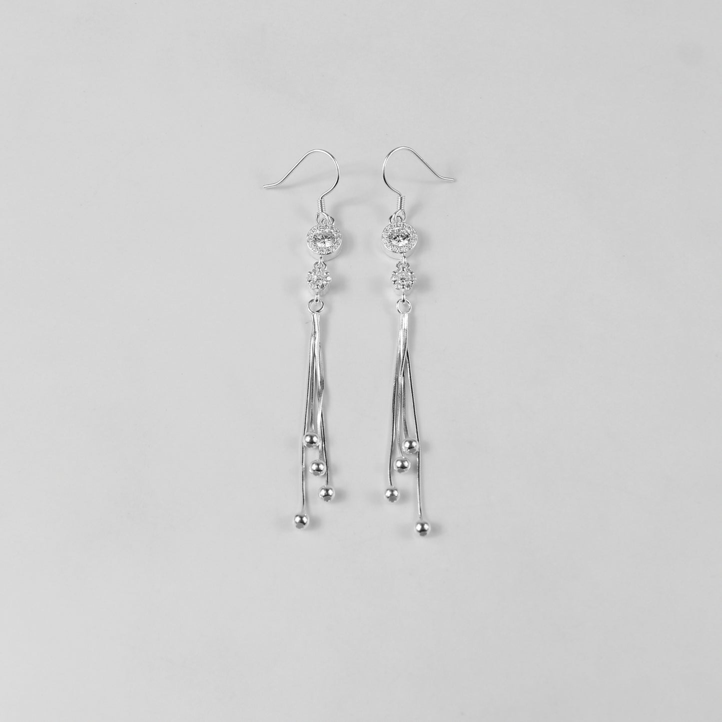 Glamorous earrings crafted with 925 sterling silver, showcasing intricately arranged silver beads with a radiant finish. Perfect for making a bold yet refined style statement.