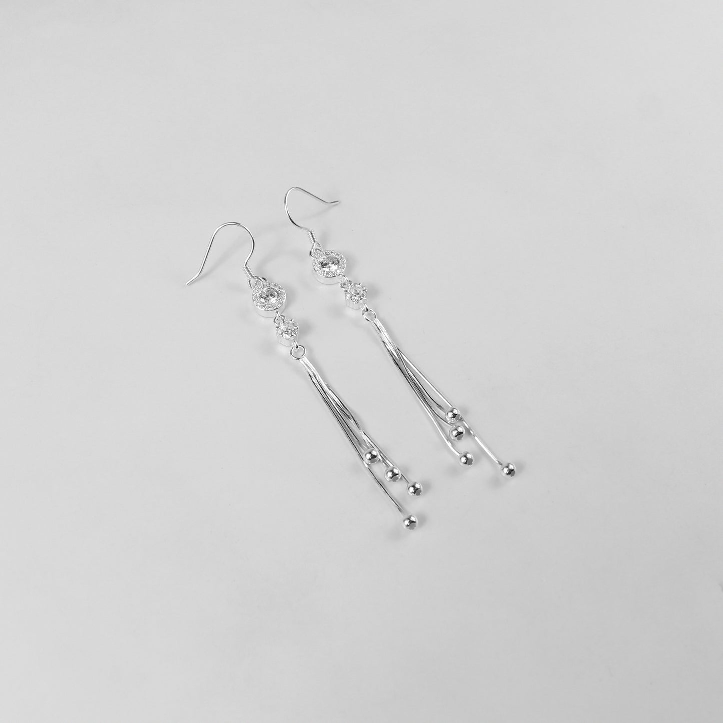 Glamorous earrings crafted with 925 sterling silver, showcasing intricately arranged silver beads with a radiant finish. Perfect for making a bold yet refined style statement.