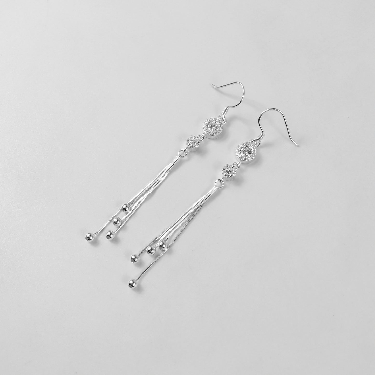 Glamorous earrings crafted with 925 sterling silver, showcasing intricately arranged silver beads with a radiant finish. Perfect for making a bold yet refined style statement.