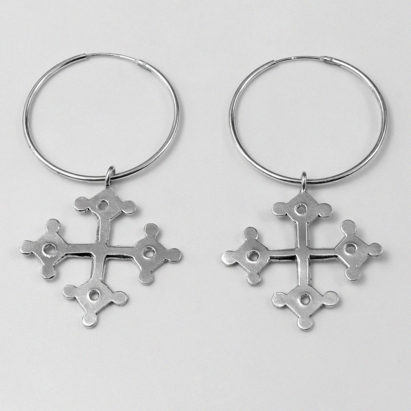 Occitan Earrings - An elegant pair of 925 sterling silver earrings by GetTheJuice, featuring an intricate design inspired by the rich history and culture of the Occitan region, adding a touch of heritage and sophistication to any look.
Occitan Earrings - A stunning pair of 925 sterling silver earrings by GetT