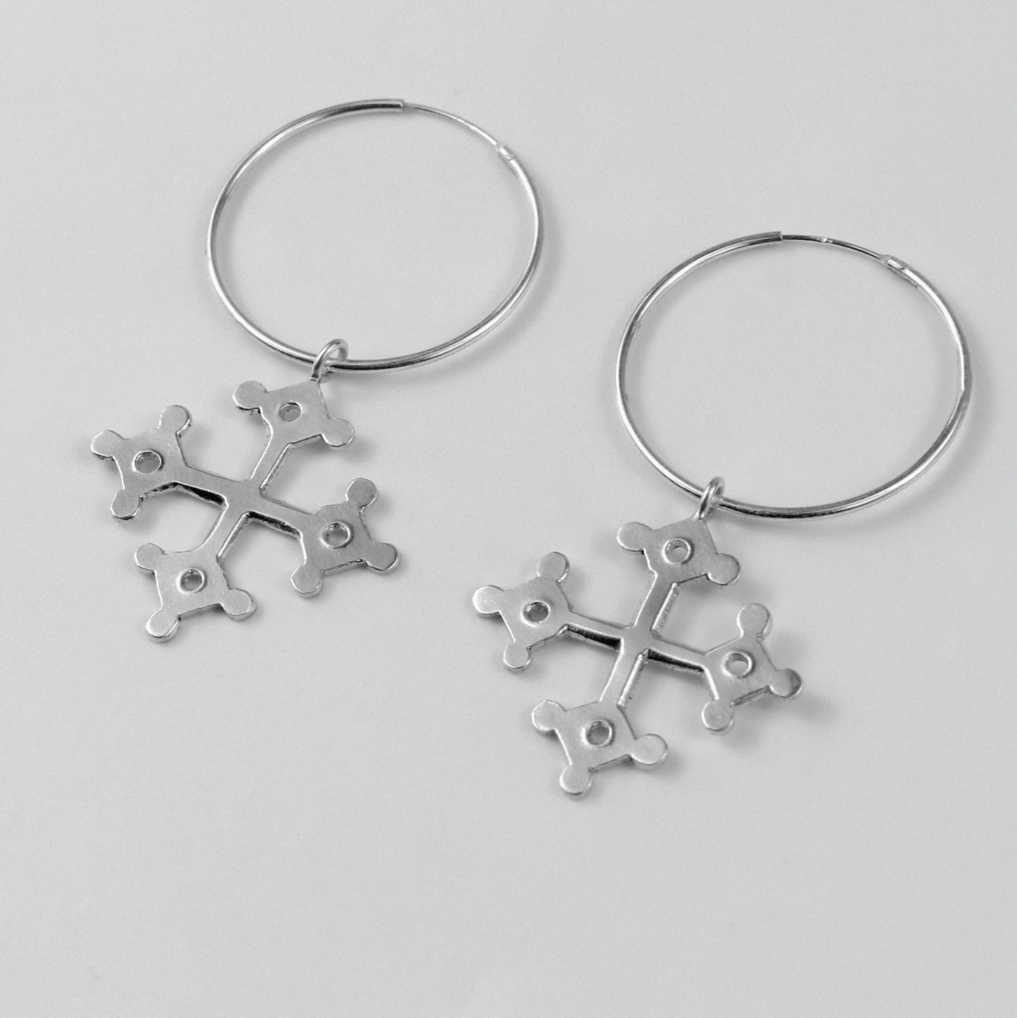 Occitan Earrings - An elegant pair of 925 sterling silver earrings by GetTheJuice, featuring an intricate design inspired by the rich history and culture of the Occitan region, adding a touch of heritage and sophistication to any look.
Occitan Earrings - A stunning pair of 925 sterling silver earrings by GetT
