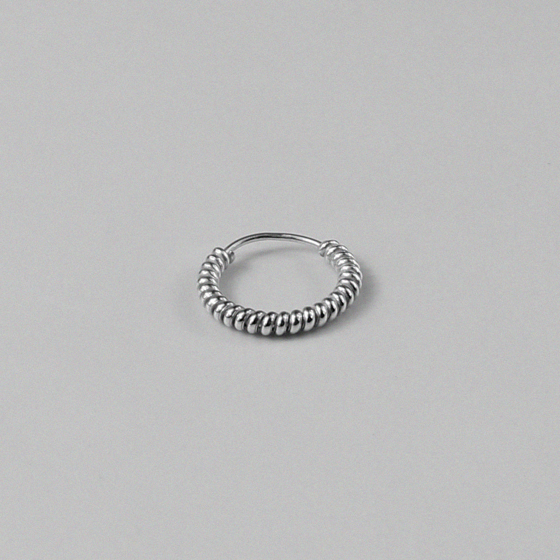 Twist Hoop Earrings - An exquisite pair of 925 sterling silver earrings by GetTheJuice, with a beautifully twisted design that combines classic hoops with a fresh, elegant twist.