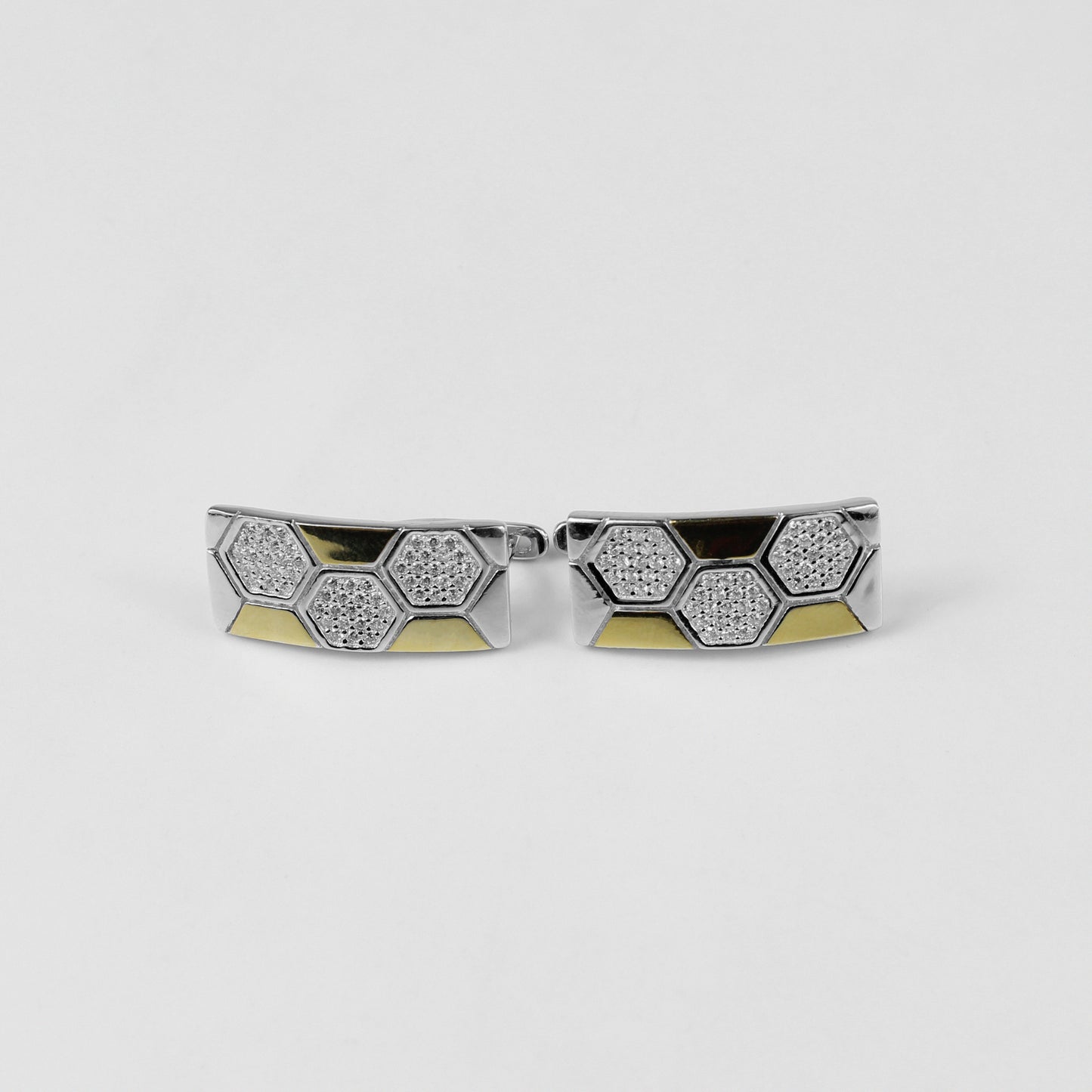 A pair of sleek 925 sterling silver ear studs featuring a geometric hexagonal motif, inspired by lunar elegance. These modern and versatile studs add a touch of celestial sophistication to any outfit.
