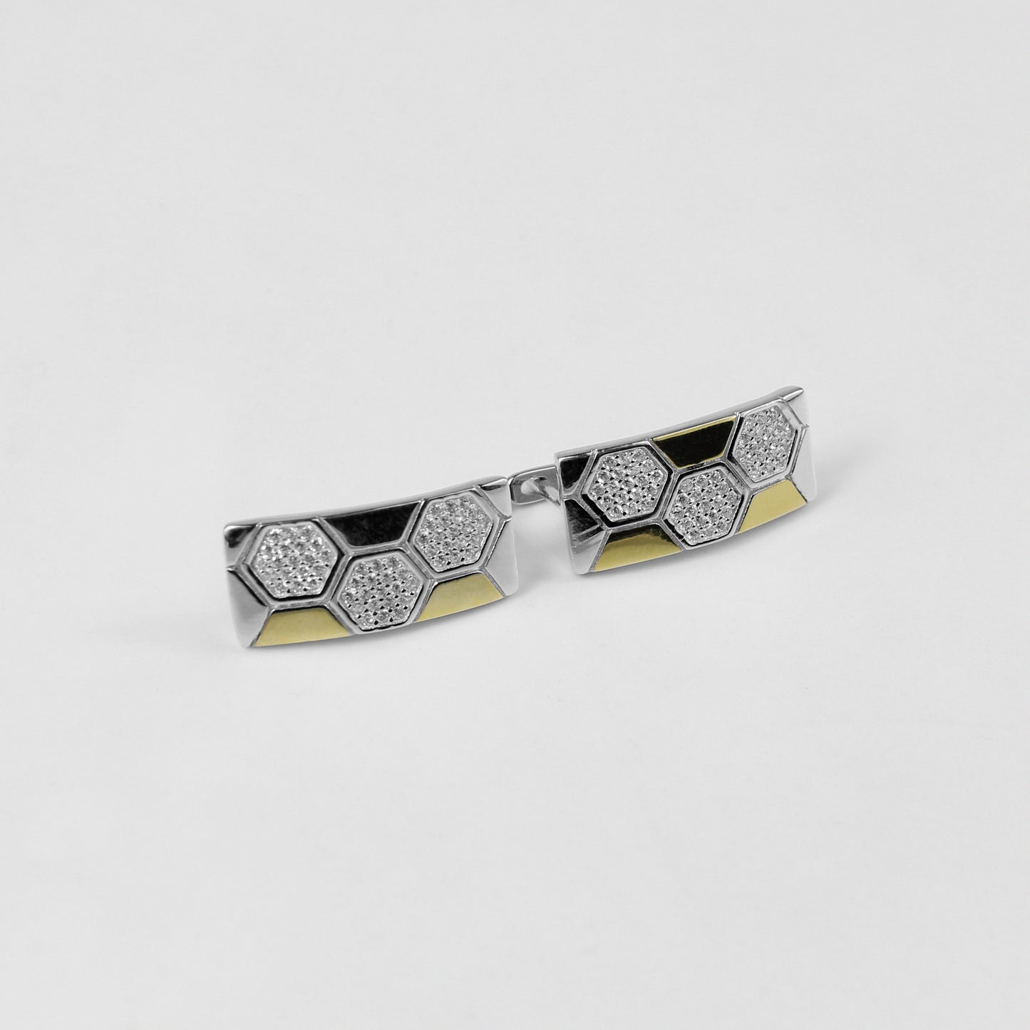 A pair of sleek 925 sterling silver ear studs featuring a geometric hexagonal motif, inspired by lunar elegance. These modern and versatile studs add a touch of celestial sophistication to any outfit.