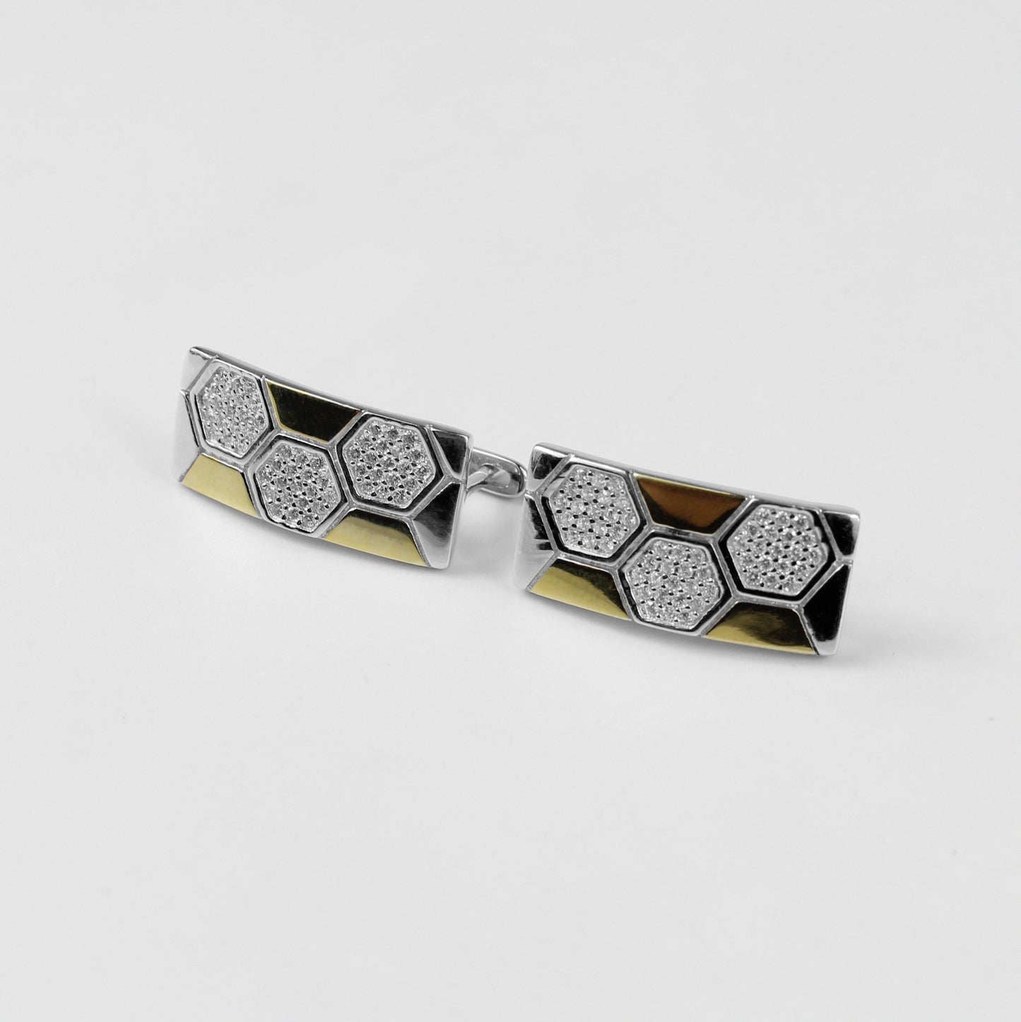 A pair of sleek 925 sterling silver ear studs featuring a geometric hexagonal motif, inspired by lunar elegance. These modern and versatile studs add a touch of celestial sophistication to any outfit.