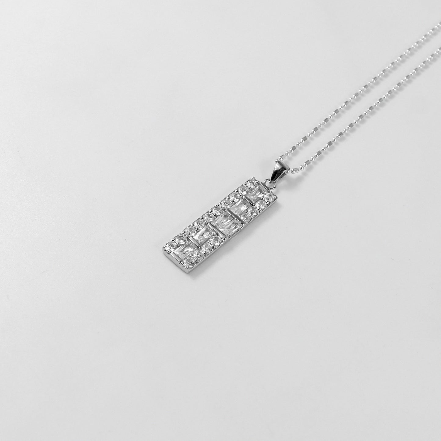 A refined necklace named 'Alba,' crafted from 925 sterling silver. Its design embodies the gentle beauty of dawn, radiating a serene and elegant charm.