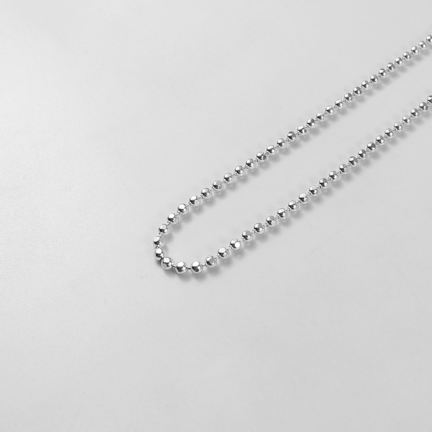 925 Sterling Silver Ball Necklace by GetTheJuice: A sleek and timeless ball necklace crafted from high-quality 925 sterling silver, perfect for adding a touch of elegance to any outfit.
