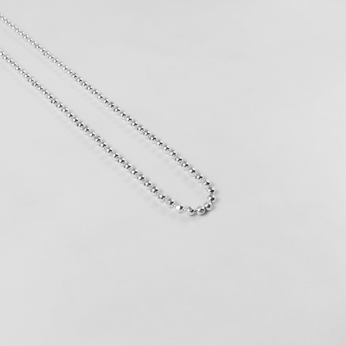 925 Sterling Silver Ball Necklace by GetTheJuice: A sleek and timeless ball necklace crafted from high-quality 925 sterling silver, perfect for adding a touch of elegance to any outfit.
